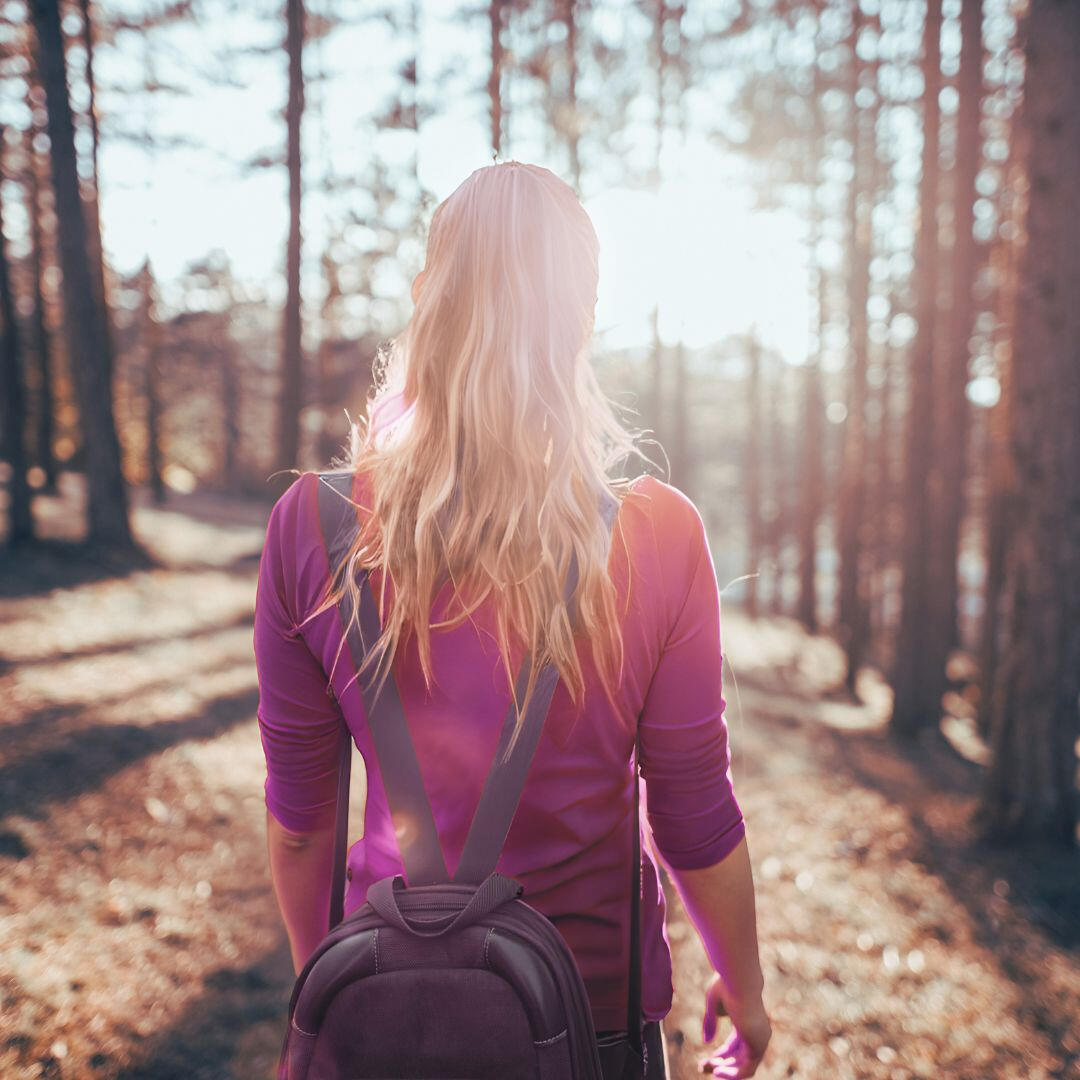 My Journey Image of a girl hiking in the woods indicative of this journey of living loved